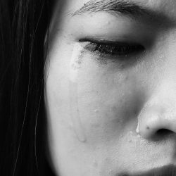 A photo by Marie Yip, titled, "Poet in Tears"